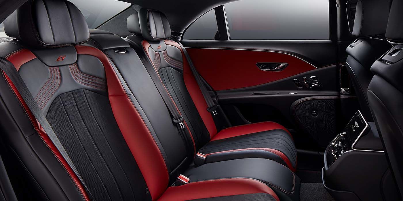 Bentley Zurich Bentley Flying Spur S sedan rear interior in Beluga black and Hotspur red hide with S stitching