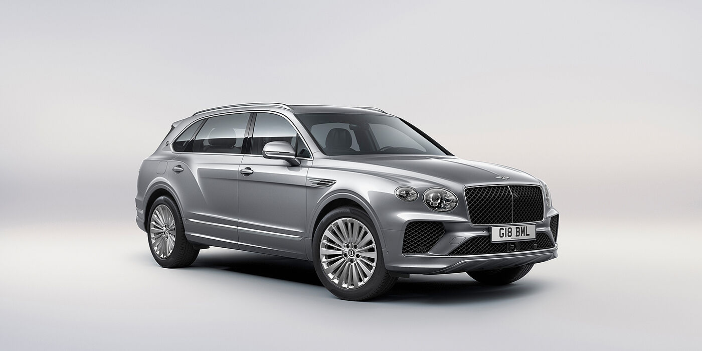 Bentley Zurich Bentley Bentayga Extended Wheelbase luxury SUV front three quarter view in Moonbeam paint with 21 inch five spoke painted wheels