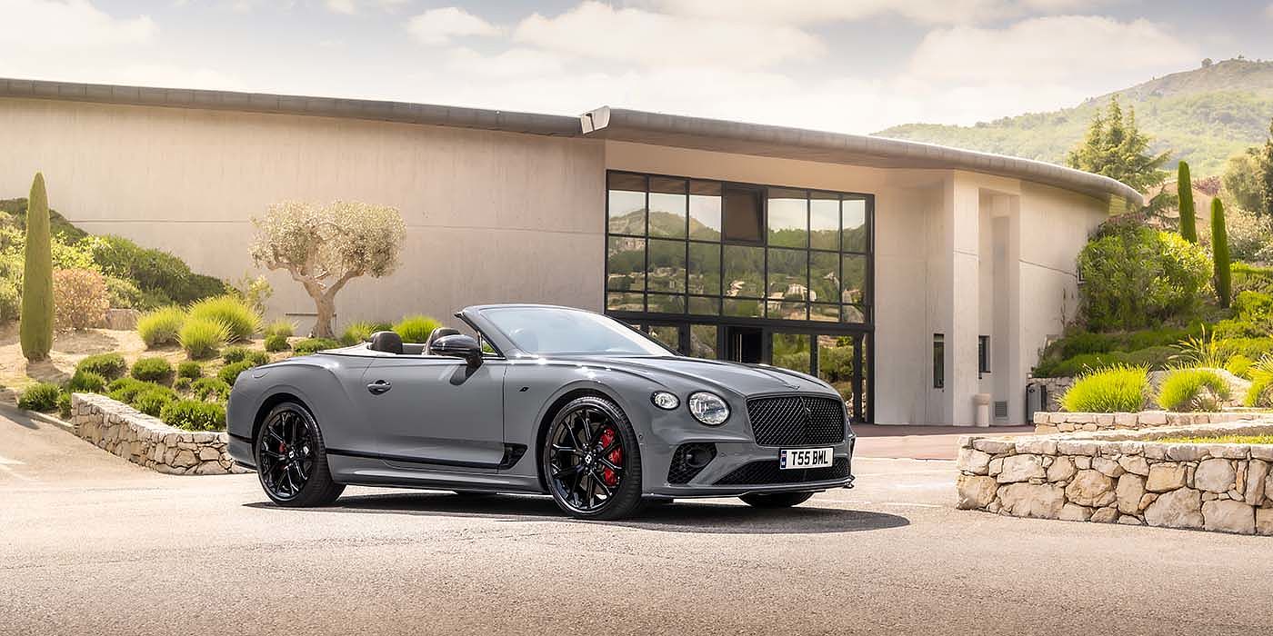 Bentley Zurich Bentley Continental GTC S convertible in Cambrian Grey paint front 34 static near house