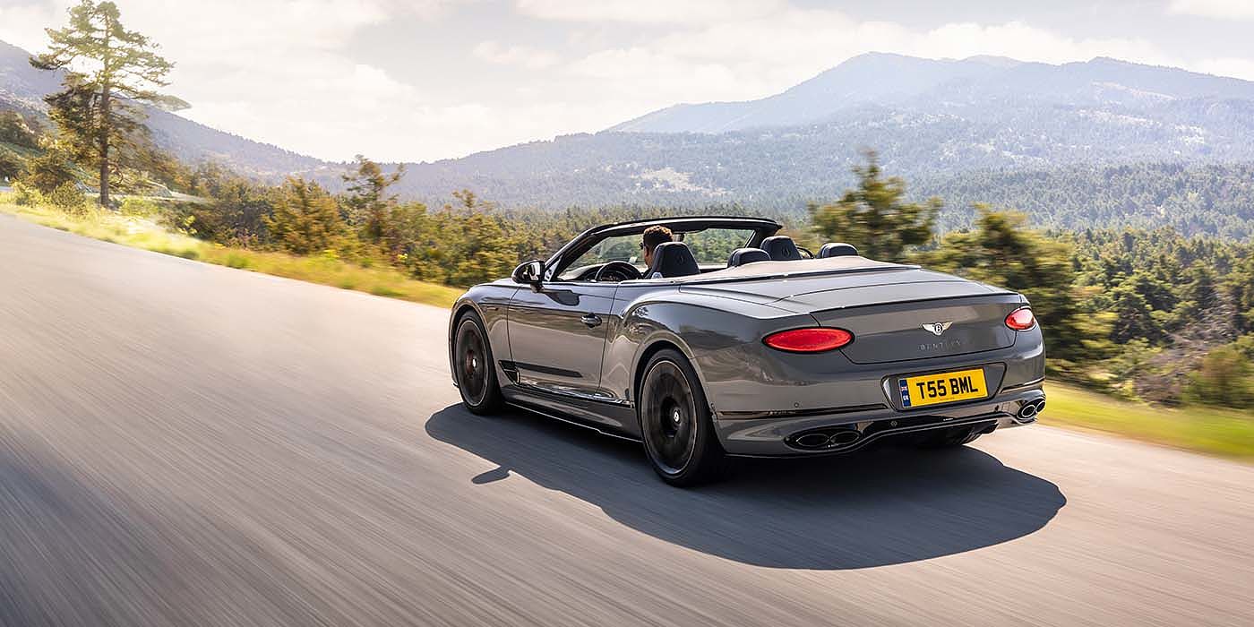 Bentley Zurich Bentley Continental GTC S convertible in Cambrian Grey paint rear 34 dynamic driving