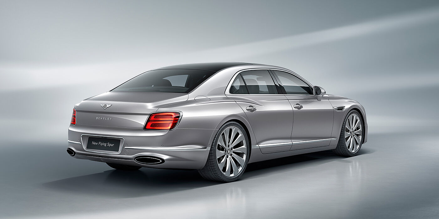 Bentley Zurich New Bentley Flying Spur sedan rear view in Silverlake paint with ten spoke wheels and chrome matrix grille