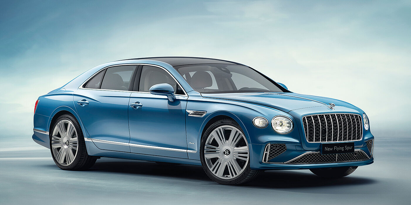 Bentley Zurich New Bentley Flying Spur Azure sedan front view in Light windsor blue by Mulliner paint with 22 inch Azure wheels and chrome exterior details