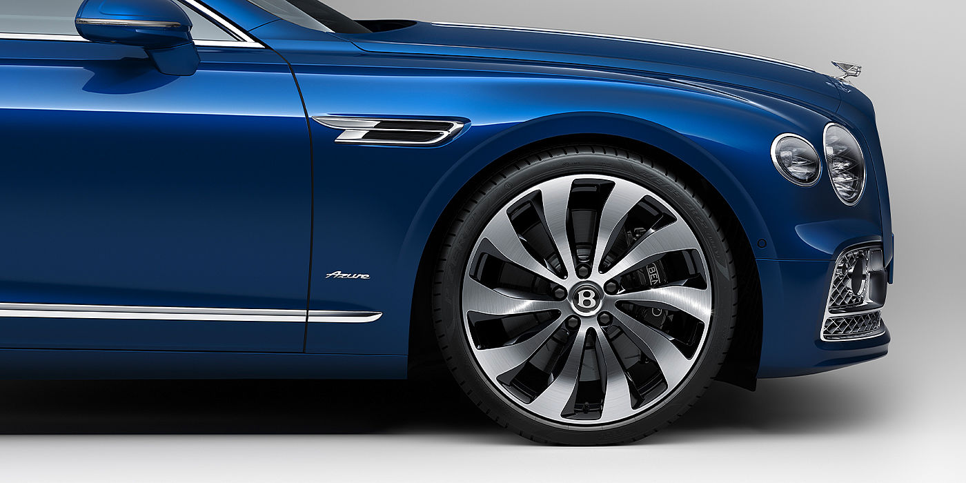 Bentley Zurich Bentley Flying Spur Azure sedan side close up in Sequin Blue paint with Azure badge