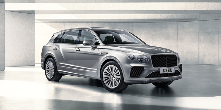 Bentley Zurich Bentley Bentayga Extended Wheelbase SUV front three quarter in Moonbeam paint with a grey background