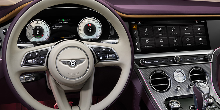 Bentley Zurich Bentley Continental GTC Mulliner convertible steering wheel and drivers screens surrounded by Damson purple and Linen hides